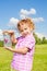 Lilttle girl holds jar with buterfly