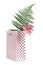 Lily flower and fern in a pink gift bag isolated