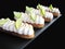 Lime eclairs with toasted meringue and frech line slices