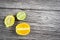 lime and fruits on wood background. top view. no photoshop used.