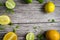 lime and fruits on wood background. top view. no photoshop used.