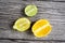 lime and fruits on wood background. top view. no photoshop used.