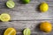 lime and fruits on wood background. top view. no photoshop used.