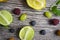 lime and fruits on wood background. top view. no photoshop used.