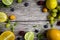 lime and fruits on wood background. top view. no photoshop used.