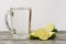 Lime glass and a glass of drink on a wooden table