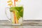 Lime glass and a glass of drink on a wooden table