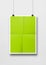 Lime green folded poster hanging on a white wall with clips