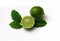 Lime green on white background. Ripe lime with leaves, cut in half close-up. Juicy refreshing fruit