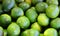Lime is a hybrid citrus fruit, which is typically round,