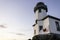 Lime Kiln Lighthouse with the orca whale warning flag in San Juan Islands