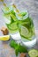Lime, mint, cucumber cocktail with bottles, lemonade, detox wate