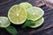 Lime and mint on a wooden table. traditional ingredients for winter vitamin tea