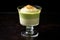 lime mousse in a vermouth glass with a lime twist