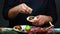 Lime splash in chef hand under mexican burito. Close up of a chef hands preparing mexican burito. The concept of mexican cooking r