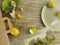 Limes, lemons, flowers from the package from the market on the kitchen table, healthy food