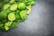 Limes and mint on stone background. Top view with copy space