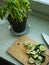 Limes sliced on wooden cutting board and basil