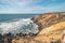 Limestone crumbling cliffs on the Atlantic coast Odemira region, western Portugal. Wandering along the Fisherman Trail, Rota