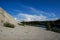 Limestone mountains and calm blue groundwater lake in an old quarry