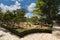 Limestone path and windmill in beautiful summer gardens of Palazzo Parisio, Naxxar, Malta, Europe.