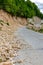 Limestone rockfall and landslide fallen on a tarmac road leading to Khvamli Mountain peak in Georgia