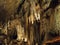 Limestone stalactites drip in strange formations