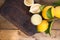 Limoncello and lemons on a wooden board. The traditional alcoholic beverage of Italy, from citrus. Fresh fruits and drinks. Free