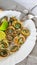 Limpets molluscs with lime on white plate