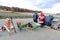 LIN, ALBANIA- DECEMBER 9,2017: Peasant farmers sell onion on the sidewalk of road to the city of Pogradec in Albania