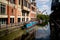 Lincoln, United Kingdom - 07/21/2018: The River Witham going through the centre of Lincoln, with the empowerment sculpture in
