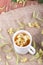 Linden tea in a cup on a wooden background.