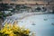 Lindos city beach, Greece. Sand beach with white sunbeds and umbrellas