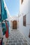 Lindos, Greece. 05/28/2018. Every inch of free wall is old town is used as a display of items for sale to tourists. Island of