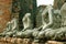 Line of ancient Buddha statues