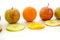 Line of apples and slices with one orange