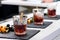 Line of classic alcoholic Godfather cocktails in rocks glasses a