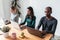 Line of concentrated employees working with laptops on coworking place