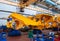 Line, conveyor for the production of large yellow trucks, mining trucks. Shop factory.