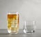 Line of different glasses. Two glasses with empty and yellow wine, three empty glasses