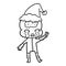 line drawing of a big brain alien crying and giving peace sign wearing santa hat