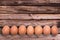 Line of eggs on wooden planks, easter background