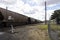 Line of empty coal train wagons.