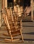 Line of empty wooden rocking chairs on porch in late afternoon symbol of Baby Boomers retirement years