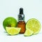 Line essential oil. Bottles of lime essential oil on a white background. Fruit essence.