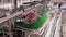 line for filling beer in a brewery. Empty green glass bottles moving on a conveyor belt in a queue at a beer factory.