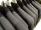 Line Of Grey Suit Jackets On Coat Hangers