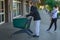 Line of italian people during coronavirus pandemic: social distancing of a couple queuing up with a shopping cart for groceries