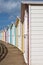 Line of locked English seaside chalets out of season