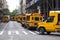 Line of many School busses back to school urban city kids New York city, USA, 09/30/2018